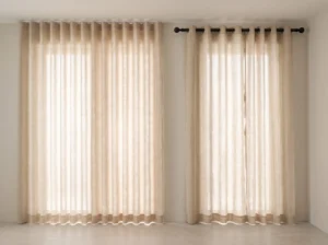 Wave curtain on a ceiling track next to an eyelet curtain on a decorative rod